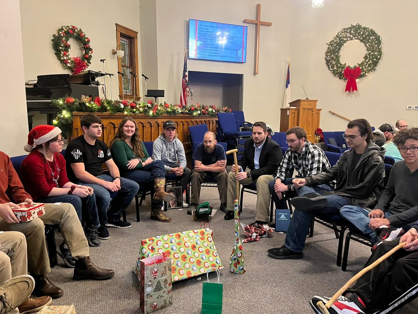 Plains Baptist Church teens and college white elephant gift exchange at Christmas party